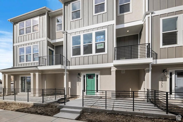 townhome / multi-family property featuring board and batten siding