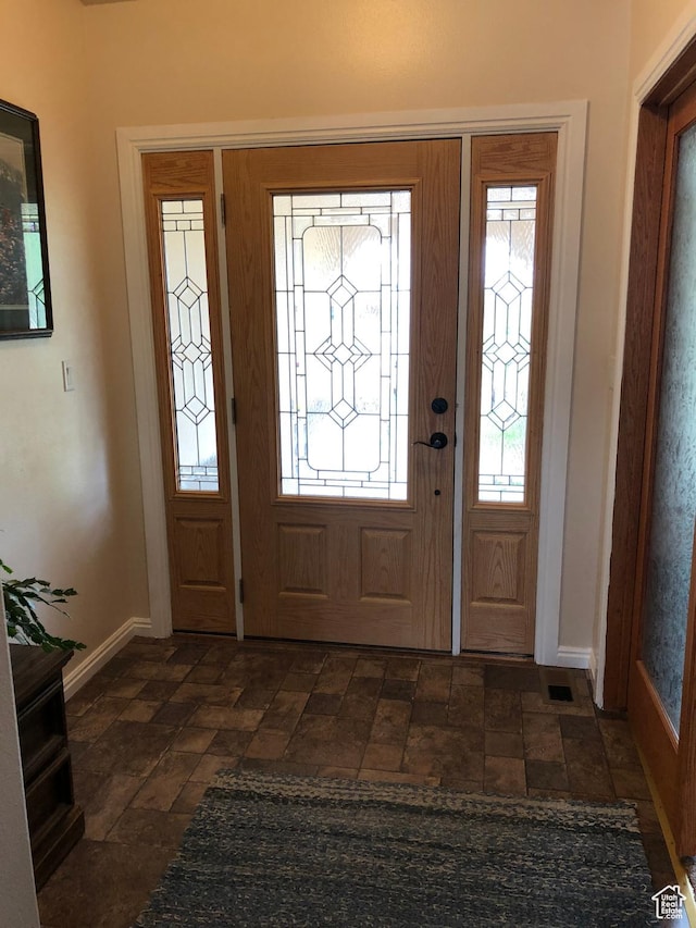 4710 Luna Cir, Moab, UT 84532 - foyer entrance featuring visible vents, stone finish flooring, and baseboards