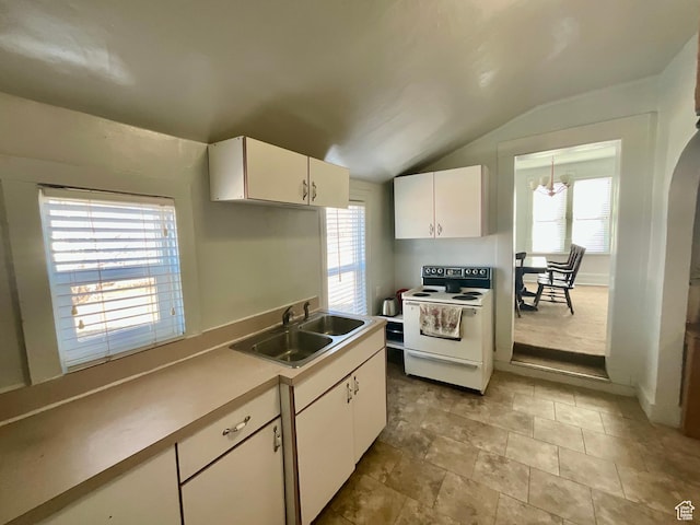 kitchen featuring white electric stove, lofted ceiling, a sink, light countertops, and white cabinets