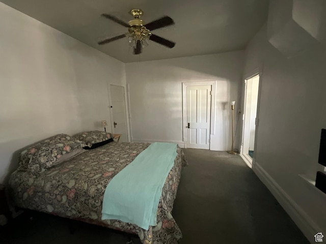 bedroom featuring a ceiling fan and dark carpet