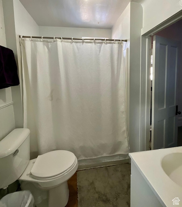 full bath with vanity, toilet, and shower / bathtub combination with curtain