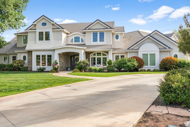 2917 S Old Farm Rd, Washington, UT 84780 - view of front of property with driveway, stone siding, and a front lawn