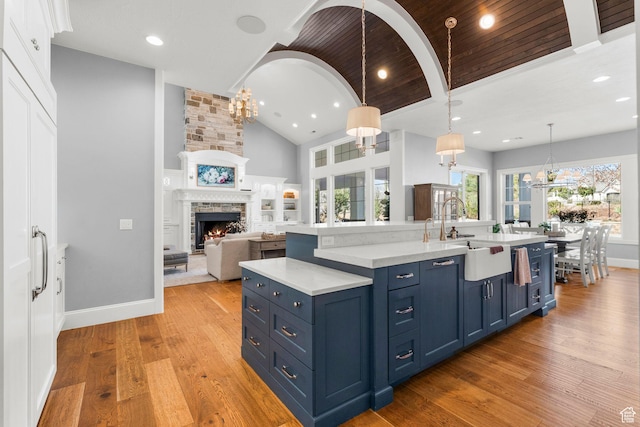 2917 S Old Farm Rd, Washington, UT 84780 - kitchen featuring light countertops, a notable chandelier, and blue cabinets