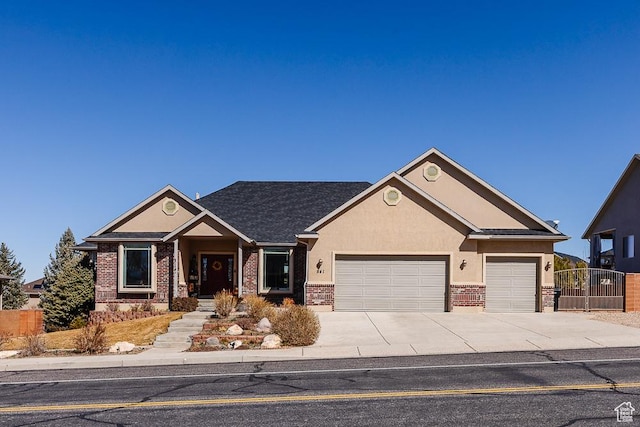841 E Nichols Canyon Rd, Cedar City, UT 84721 - craftsman-style home with stucco siding, fence, concrete driveway, an attached garage, and brick siding