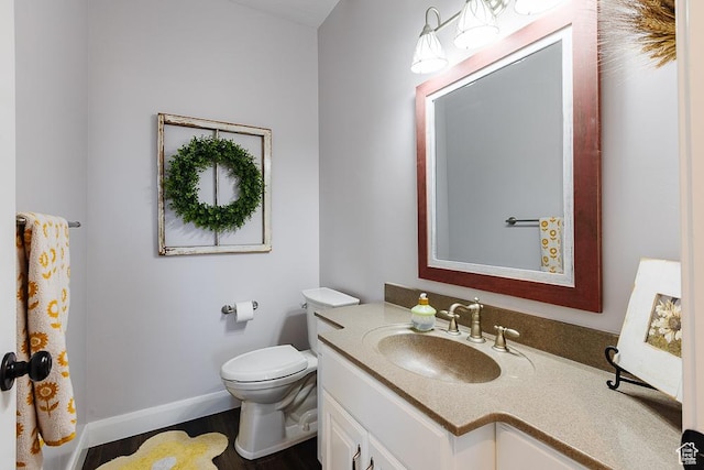 841 E Nichols Canyon Rd, Cedar City, UT 84721 - bathroom featuring vanity, toilet, wood finished floors, and baseboards