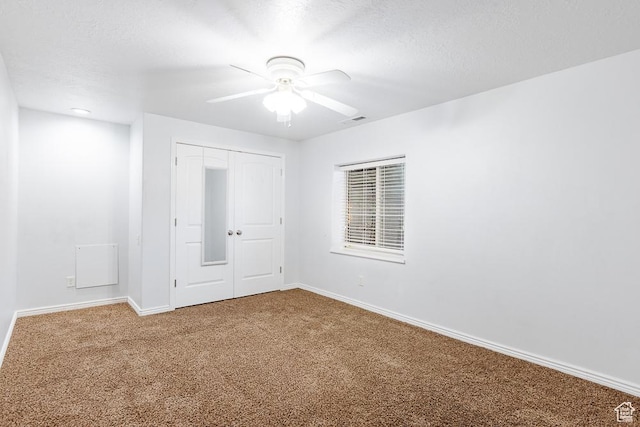 841 E Nichols Canyon Rd, Cedar City, UT 84721 - empty room with a textured ceiling, a ceiling fan, baseboards, and carpet floors