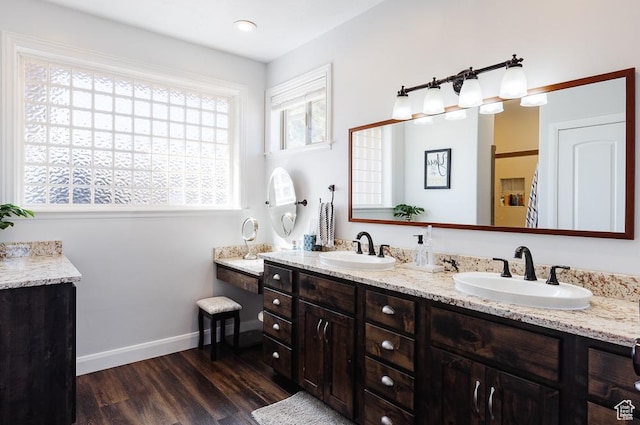 841 E Nichols Canyon Rd, Cedar City, UT 84721 - bathroom featuring a sink, baseboards, wood finished floors, and double vanity