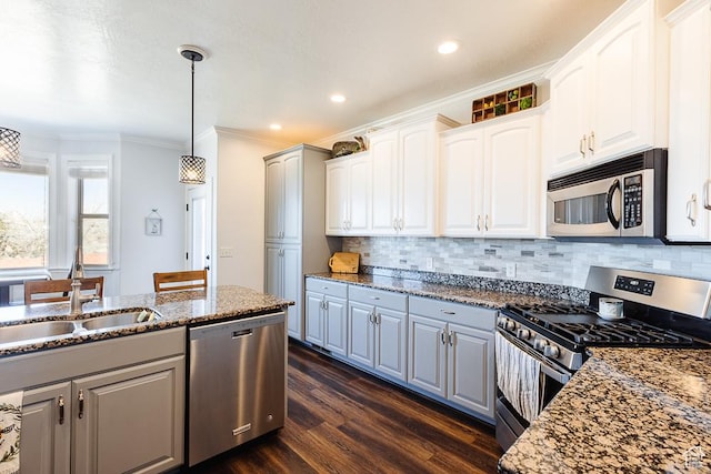 841 E Nichols Canyon Rd, Cedar City, UT 84721 - kitchen with a sink, backsplash, dark stone counters, appliances with stainless steel finishes, and dark wood-style flooring
