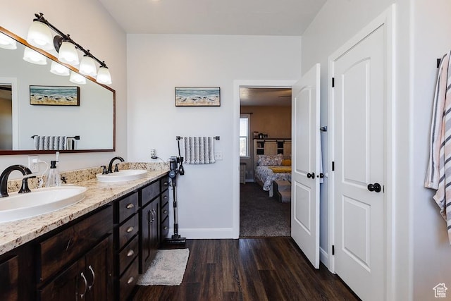 841 E Nichols Canyon Rd, Cedar City, UT 84721 - bathroom with double vanity, wood finished floors, ensuite bath, and a sink
