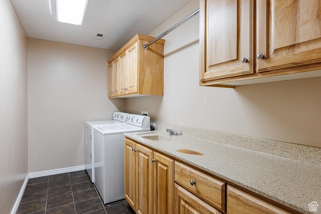 841 E Nichols Canyon Rd, Cedar City, UT 84721 - clothes washing area featuring baseboards, dark tile patterned flooring, cabinet space, a sink, and washer and clothes dryer