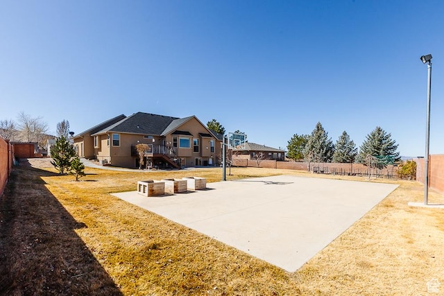 841 E Nichols Canyon Rd, Cedar City, UT 84721 - exterior space featuring a yard, basketball court, a fenced backyard, and stairway