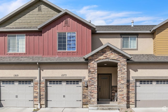 1273 N Baycrest Dr, Saratoga Springs, UT 84045 - multi unit property with board and batten siding, a shingled roof, stucco siding, a garage, and stone siding