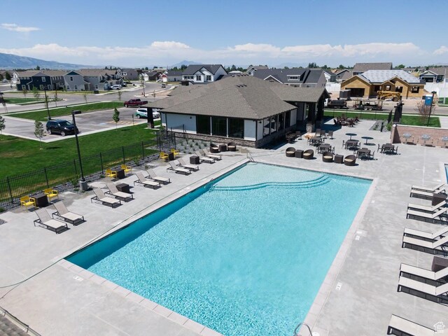 1474 E 480 S, Hyrum, UT 84319 - pool featuring a patio, fence, a residential view, and a lawn
