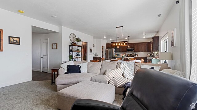 1474 E 480 S, Hyrum, UT 84319 - carpeted living room with visible vents and baseboards
