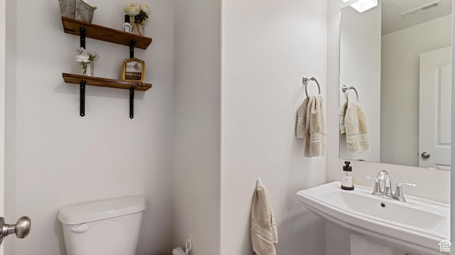 1474 E 480 S, Hyrum, UT 84319 - bathroom with visible vents, toilet, and a sink