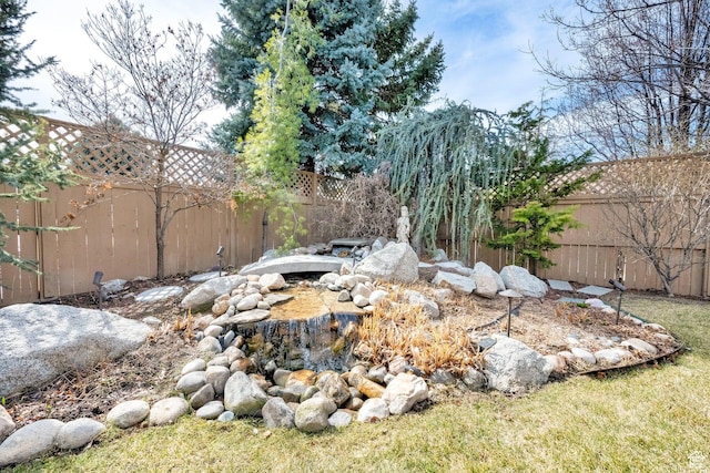 view of yard with a fenced backyard