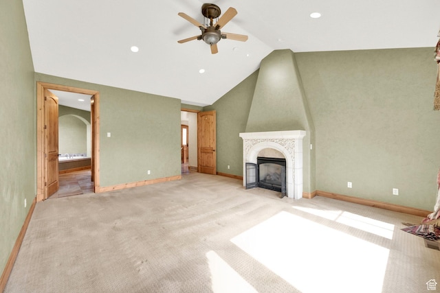 unfurnished living room with recessed lighting, a ceiling fan, carpet flooring, and a tiled fireplace