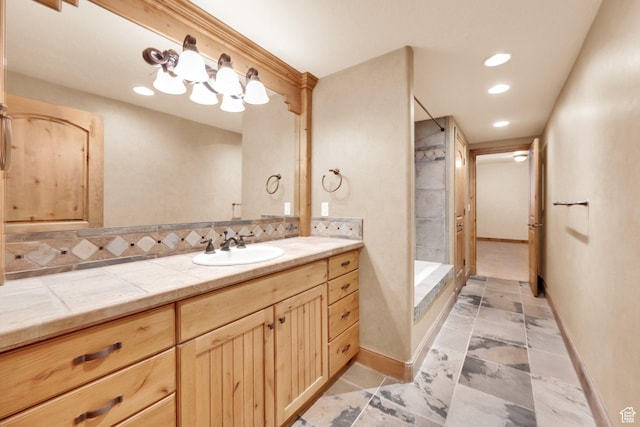 bathroom with recessed lighting, a shower, vanity, and baseboards