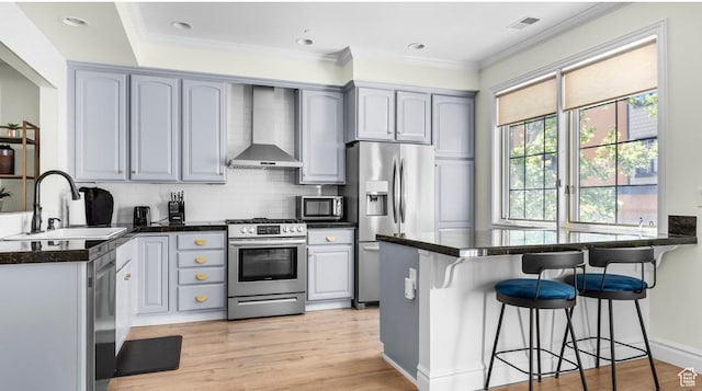 131 W Village Ln, Provo, UT 84604 - kitchen with a sink, dark countertops, stainless steel appliances, a peninsula, and wall chimney exhaust hood