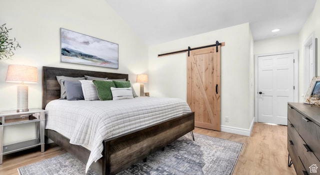 131 W Village Ln, Provo, UT 84604 - bedroom with baseboards, light wood-type flooring, a barn door, vaulted ceiling, and recessed lighting