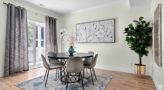 131 W Village Ln, Provo, UT 84604 - dining area with crown molding, wood finished floors, visible vents, and baseboards