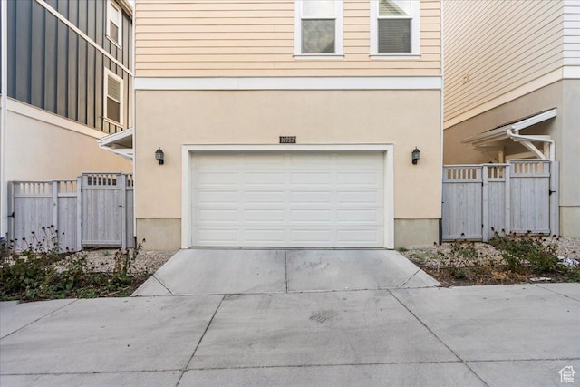 10757 S Lamond Dr, South Jordan, UT 84009 - garage featuring driveway and fence