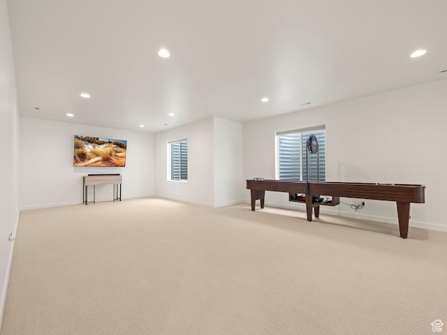 rec room featuring recessed lighting, light colored carpet, and baseboards