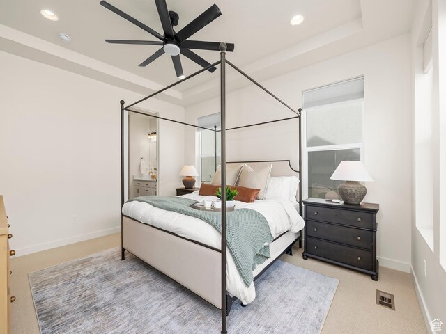 bedroom with visible vents, baseboards, a tray ceiling, carpet flooring, and recessed lighting