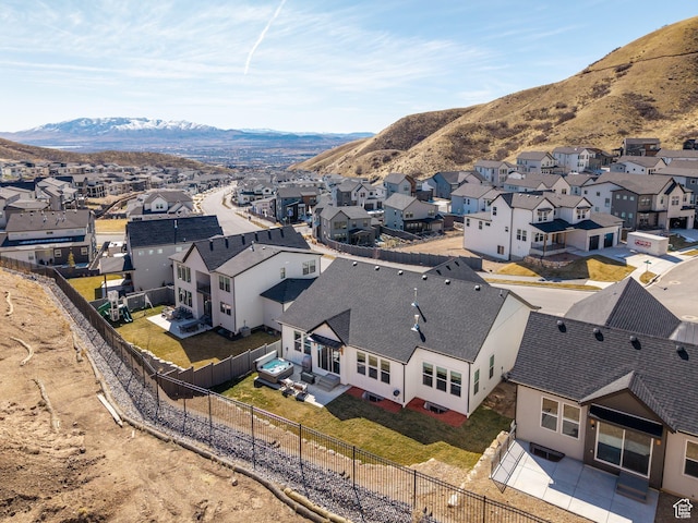 drone / aerial view featuring a residential view and a mountain view