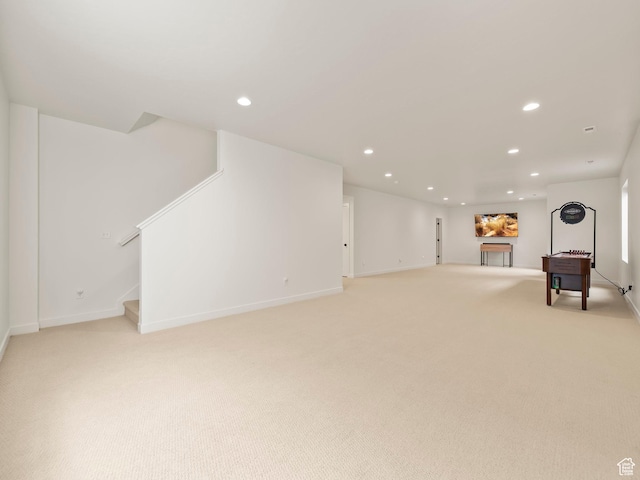 interior space featuring recessed lighting, stairway, light carpet, and baseboards