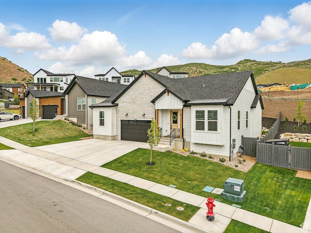 6062 N Fox Canyon Rd, Lehi, UT 84043 - modern inspired farmhouse with board and batten siding, a shingled roof, a gate, and driveway