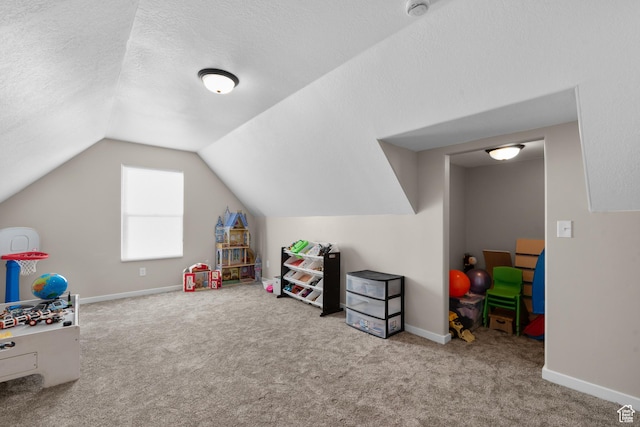 1984 S 4300 W, Ogden, UT 84401 - playroom featuring a textured ceiling, baseboards, lofted ceiling, and carpet floors