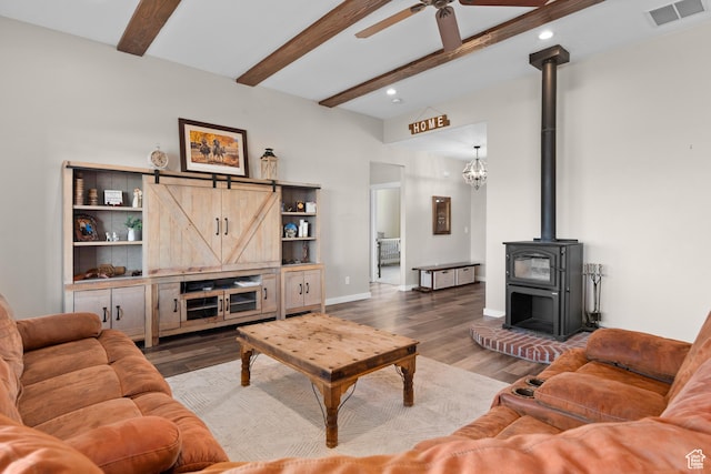 1984 S 4300 W, Ogden, UT 84401 - living room with a wood stove, beamed ceiling, visible vents, recessed lighting, and wood finished floors