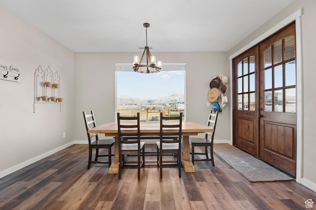 1984 S 4300 W, Ogden, UT 84401 - dining area with a chandelier, baseboards, a mountain view, and wood finished floors