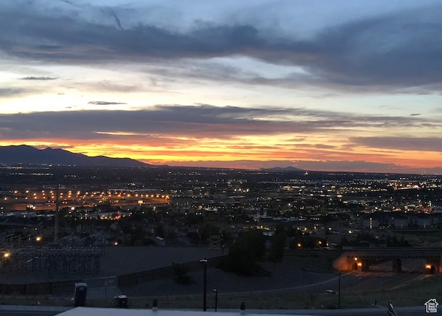 property's view of city featuring a mountain view