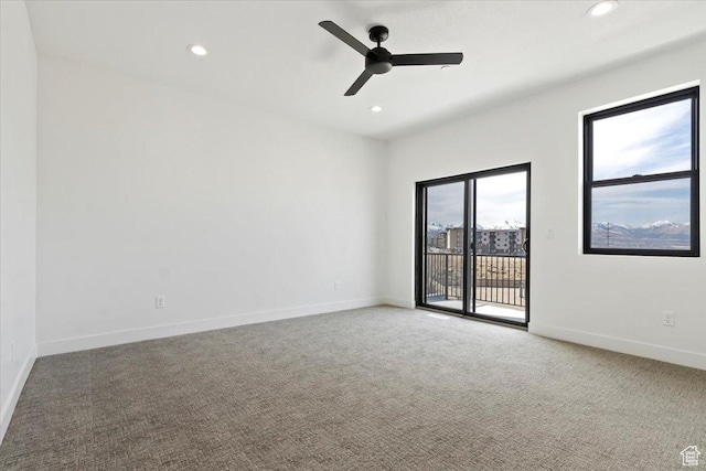 carpeted spare room featuring recessed lighting, baseboards, and ceiling fan