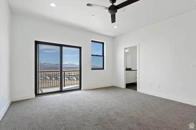 carpeted spare room featuring recessed lighting, baseboards, and ceiling fan