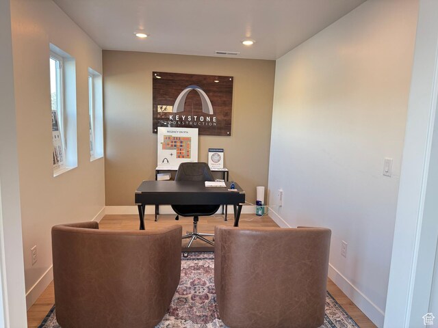 office with recessed lighting, visible vents, baseboards, and wood finished floors
