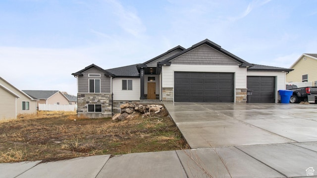1081 N 2800 W, Tremonton, UT 84337 - craftsman-style house featuring an attached garage, stone siding, and driveway