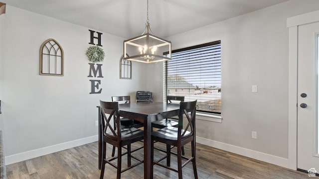 1081 N 2800 W, Tremonton, UT 84337 - dining space with a chandelier, baseboards, and wood finished floors