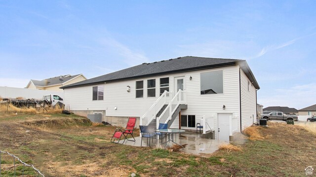 1081 N 2800 W, Tremonton, UT 84337 - back of house with a patio, central AC, a shingled roof, and fence