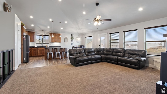 1081 N 2800 W, Tremonton, UT 84337 - carpeted living room featuring baseboards, recessed lighting, a sink, ceiling fan, and vaulted ceiling