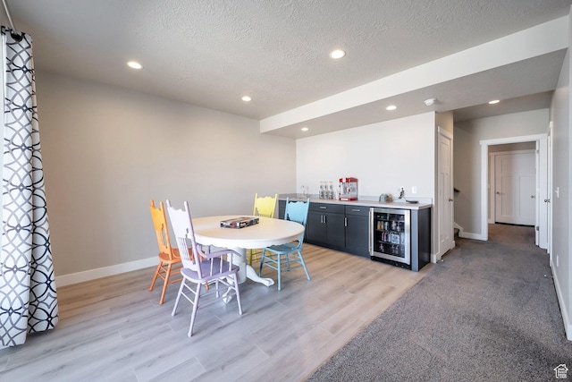 4726 W Plainfield Rd S, Herriman, UT 84096 - dining area featuring a bar, recessed lighting, beverage cooler, and baseboards