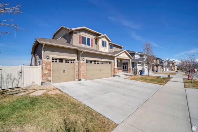 4726 W Plainfield Rd S, Herriman, UT 84096 - craftsman-style home featuring a residential view, stucco siding, stone siding, driveway, and a gate