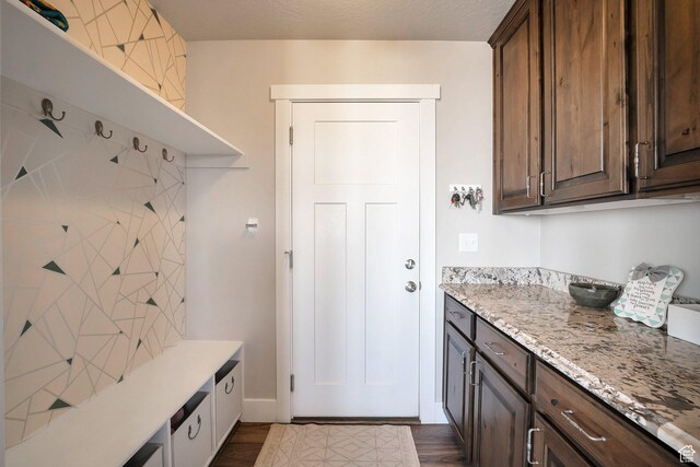 4726 W Plainfield Rd S, Herriman, UT 84096 - mudroom with dark wood finished floors and a textured ceiling