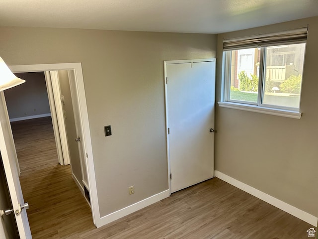 1170 S Foothill Dr Unit 311, Salt Lake City, UT 84108 - unfurnished bedroom featuring light wood-style flooring and a closet