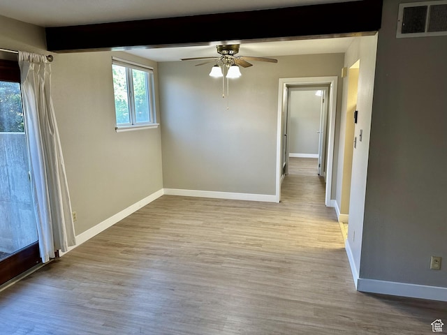 1170 S Foothill Dr Unit 311, Salt Lake City, UT 84108 - unfurnished room featuring a ceiling fan, wood finished floors, and beam ceiling