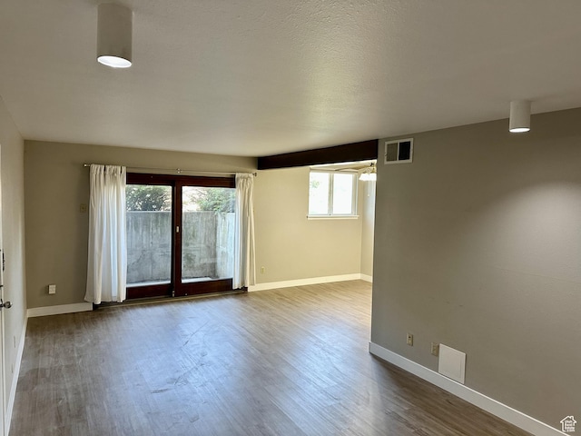 1170 S Foothill Dr Unit 311, Salt Lake City, UT 84108 - empty room with baseboards and dark wood-style floors