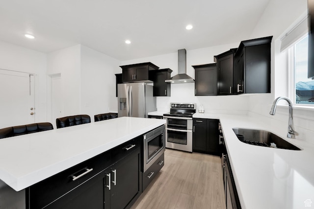 1373 E Bell Buoy Way S, Eagle Mountain, UT 84005 - kitchen with dark cabinets, appliances with stainless steel finishes, wall chimney range hood, and a sink