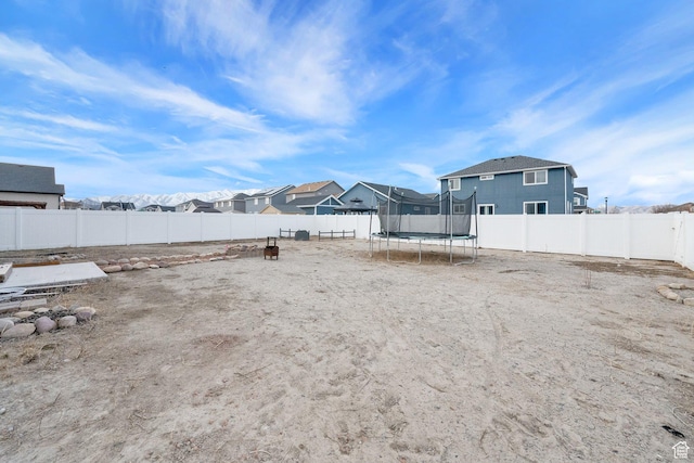 1373 E Bell Buoy Way S, Eagle Mountain, UT 84005 - view of yard with a fenced backyard, a residential view, and a trampoline